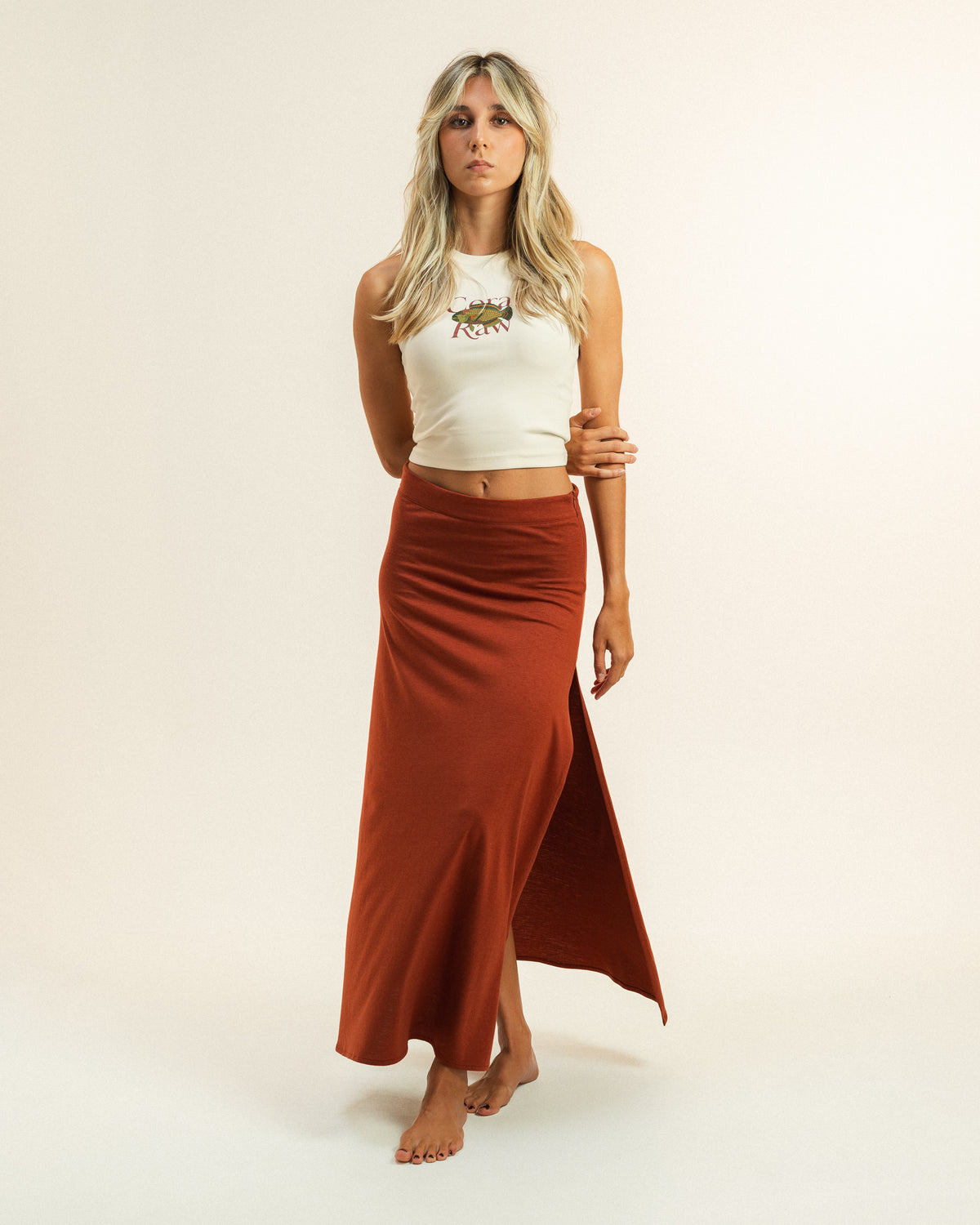 Woman wearing the ribbed Parrot Fish Tank top by Coral Raw, full body front view.