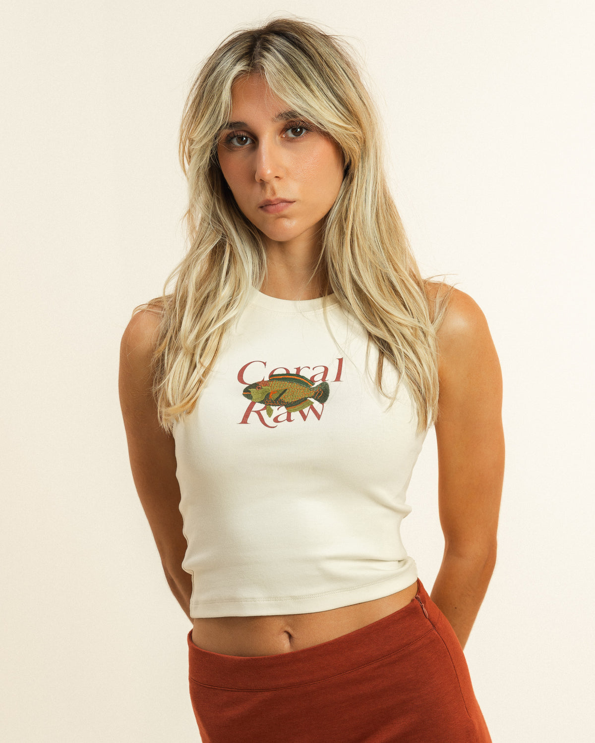 Front view of the form-fitting Parrot Fish Tank top on a female model, highlighting the ribbed knit.